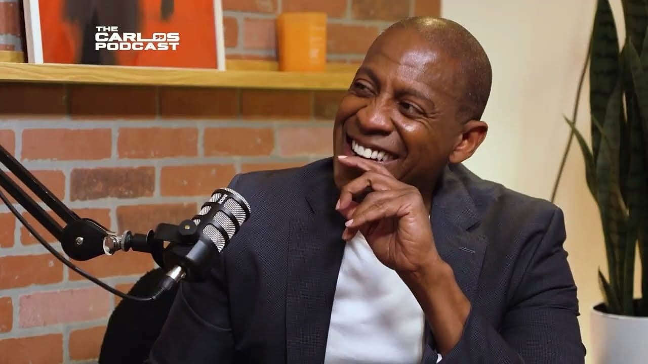 Carlos Watson laughing at the mic