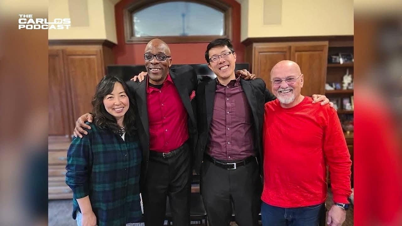 Carlos Watson posing with guests after a conversation