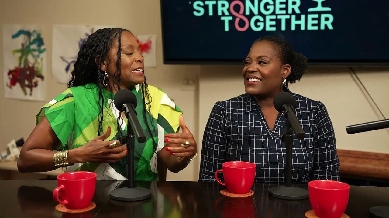 Two Watsons sisters sharing a laugh at the mic